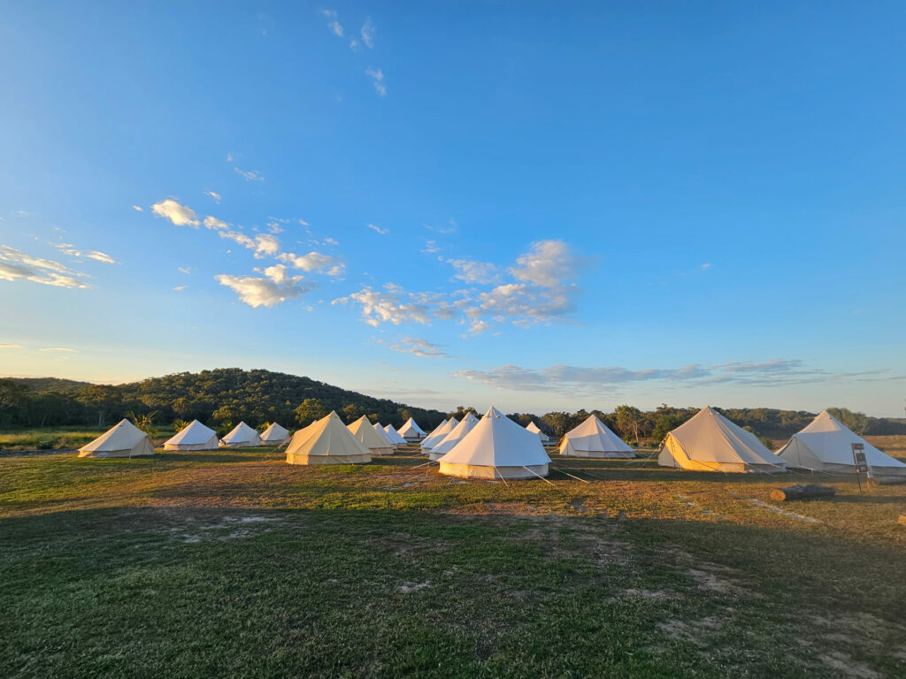 Luxury bell tent glamping camp at sunset at The Salty Lime Co