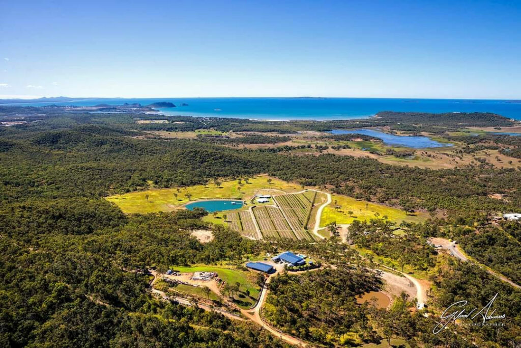 Aerial view of The Salty Lime Co glamping camp, lake and coastal setting