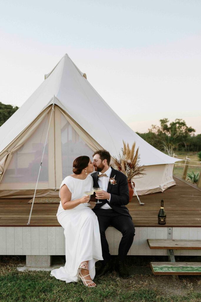 Wedding couple portrait in front of a luxury bell tent