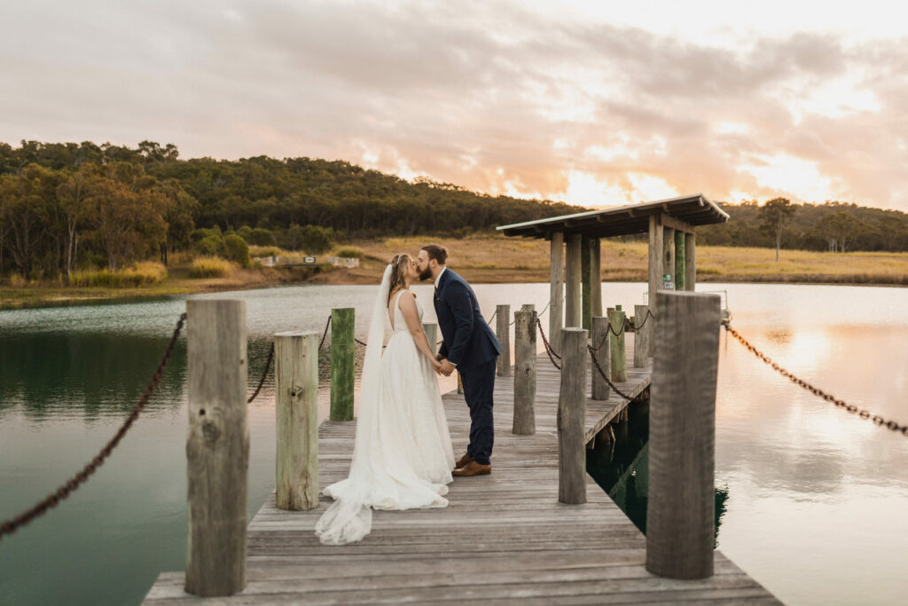 Wedding couple on the lakeside jetty at The Salty Lime Co