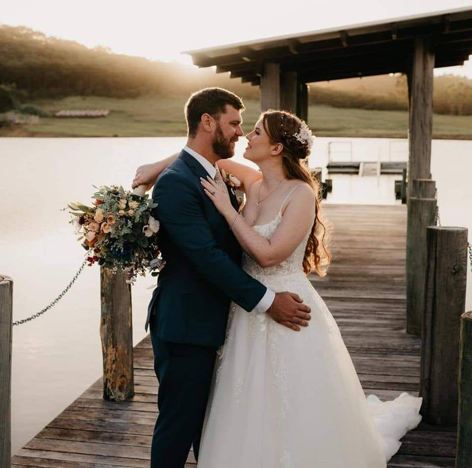Wedding couple portrait overlooking the lake and gardens