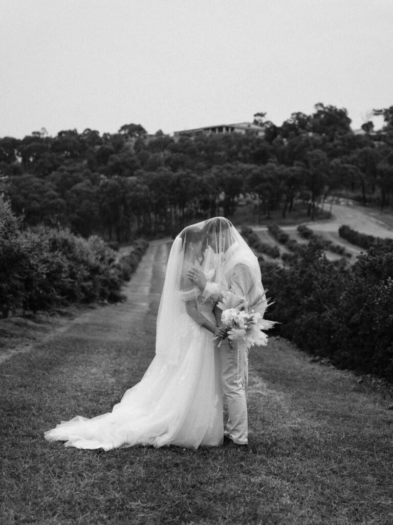 Black and white bridal portrait with bouquet
