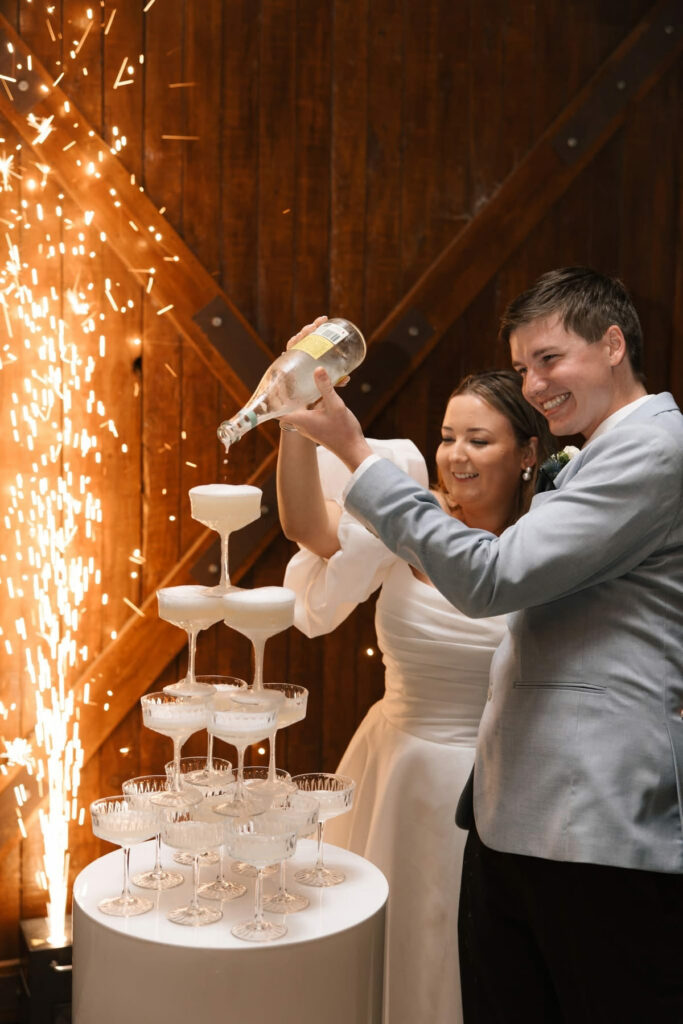 Champagne tower at an evening wedding reception