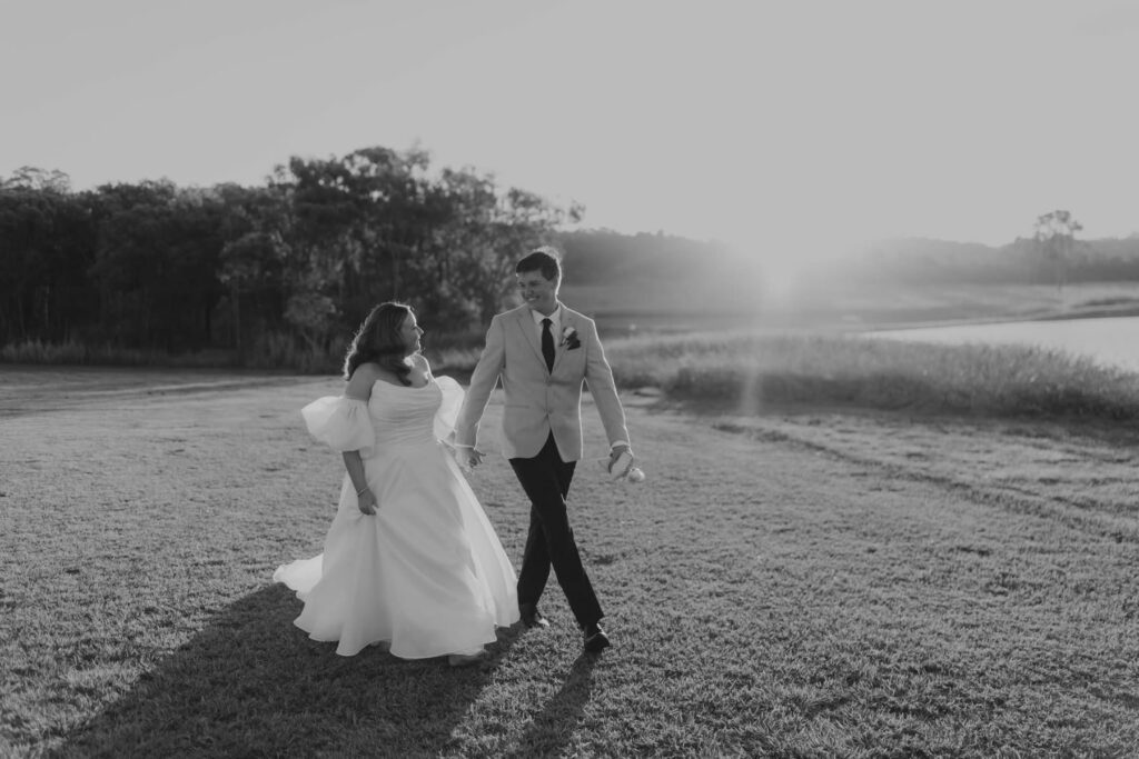 Black and white wedding portrait beside the lake