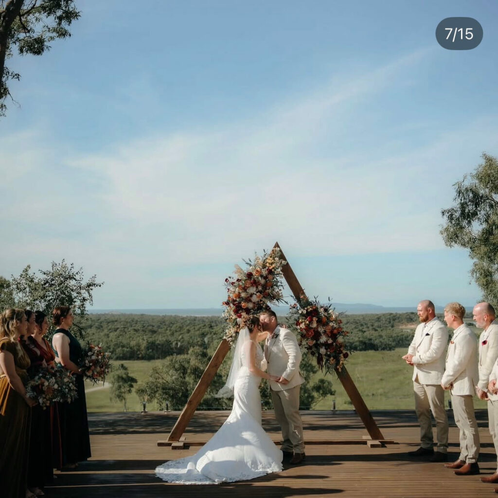 Outdoor wedding ceremony with sweeping Capricorn Coast views