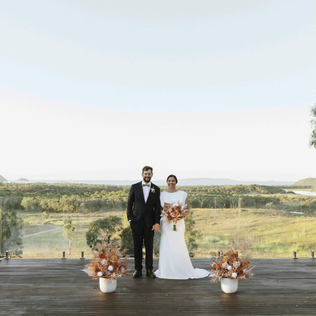 Newlyweds after their outdoor wedding ceremony