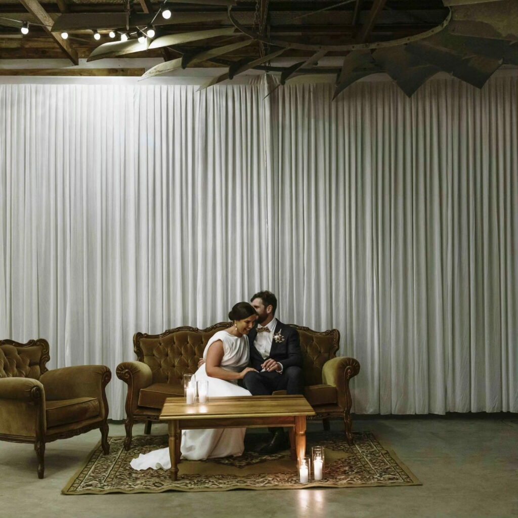 Wedding couple relaxing in the vintage lounge area