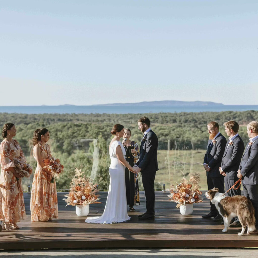 Wedding ceremony with the bridal party and mountain views