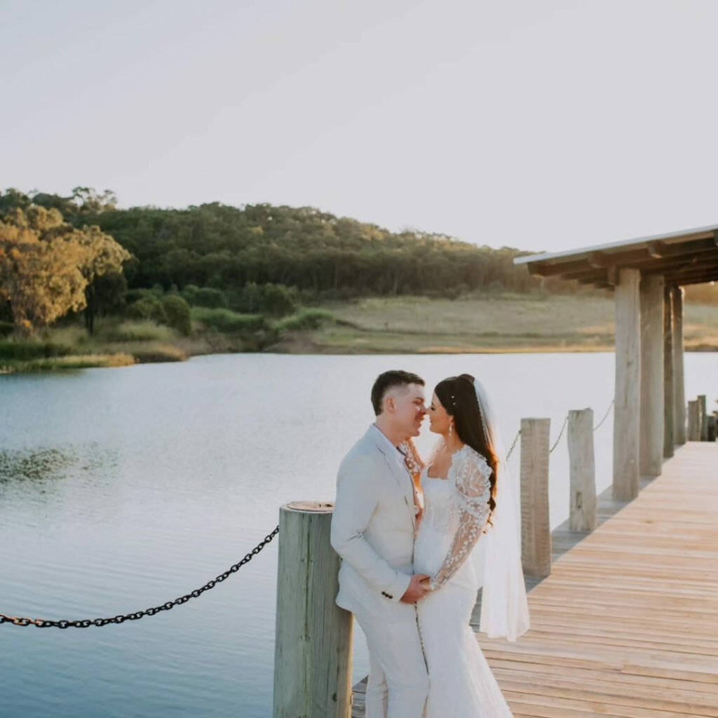 Newlyweds on the veranda overlooking the lake