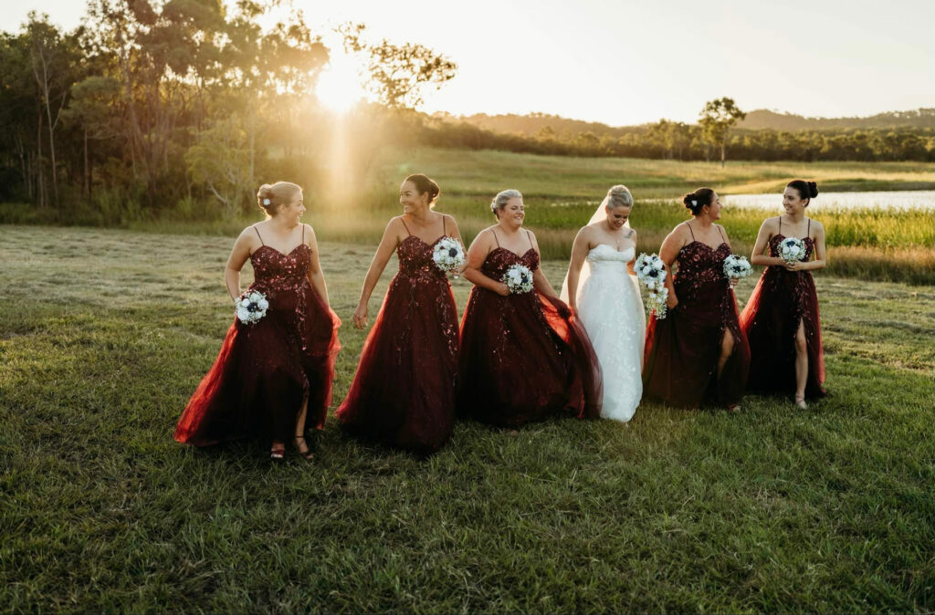 Bridal party celebrating on the lawn at The Salty Lime Co