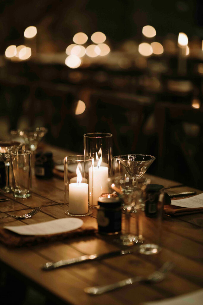 Candlelit table styling at a rustic wedding reception