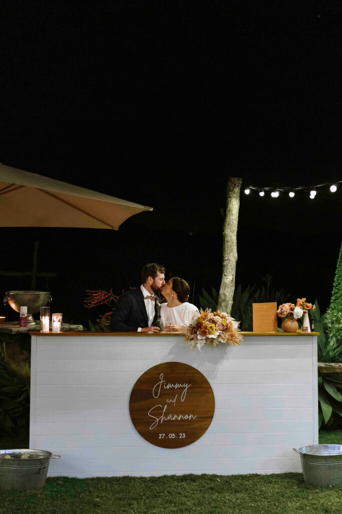 Newlyweds seated together at their personalised bridal table